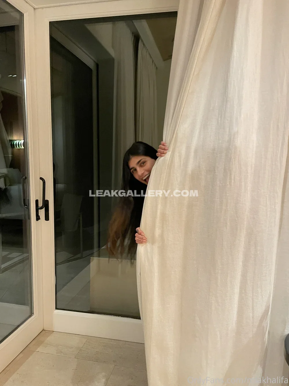 Mia Khalifa Peeking Behind Curtain OnlyFans Photo Leaked