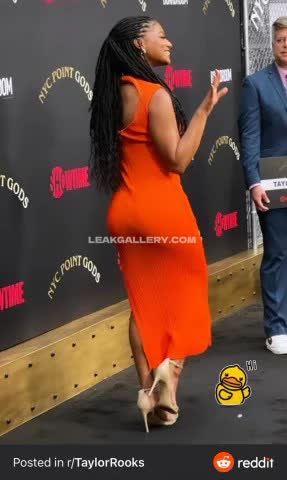 Taylorrooks Orange Dress Side Pose OnlyFans Photo Leaked